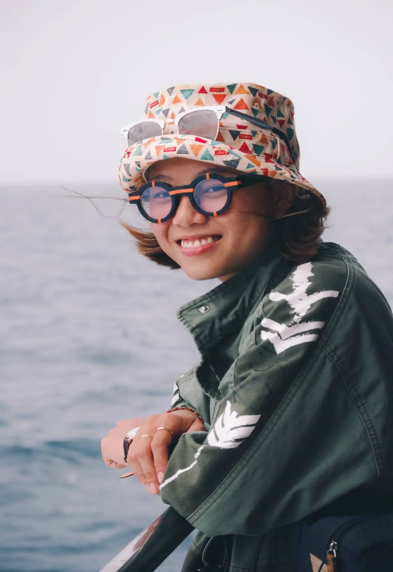 Model showcasing VoyueLens™ glasses in charcoal black with a modern matte texture.